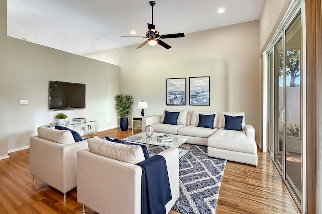 living room featuring ceiling fan and wood-type flooring