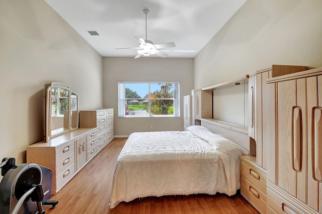 bedroom with ceiling fan and light wood-type flooring