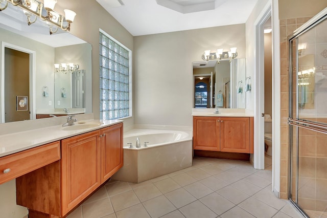 full bathroom featuring tile patterned floors, vanity, shower with separate bathtub, and toilet