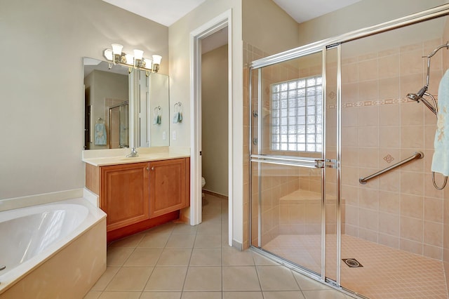 full bathroom featuring tile patterned flooring, vanity, separate shower and tub, and toilet