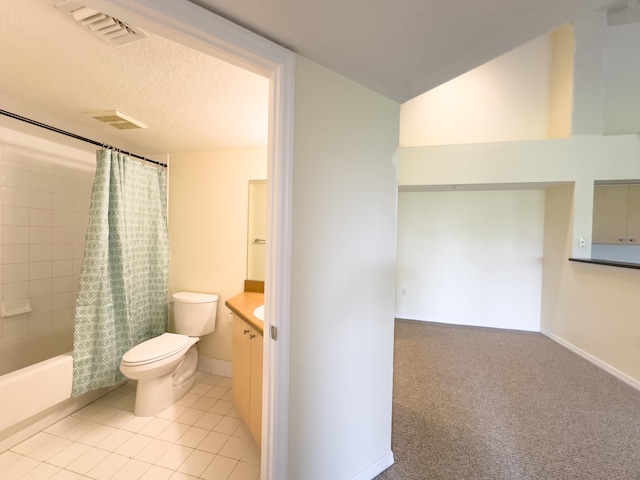 full bathroom with toilet, tile patterned floors, vanity, a textured ceiling, and shower / bath combo