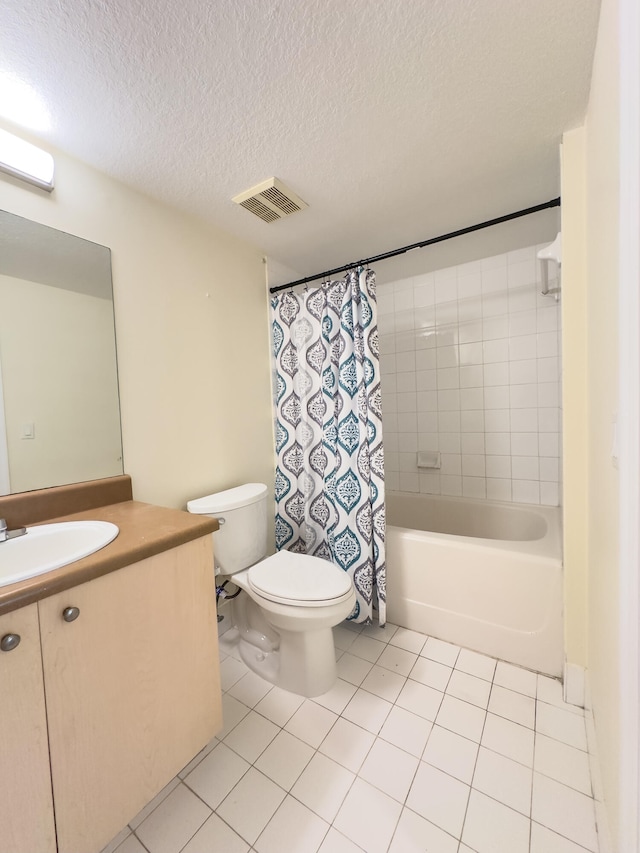 full bathroom with toilet, tile patterned floors, vanity, a textured ceiling, and shower / tub combo with curtain