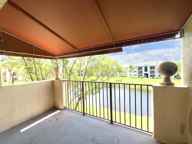 balcony featuring a water view