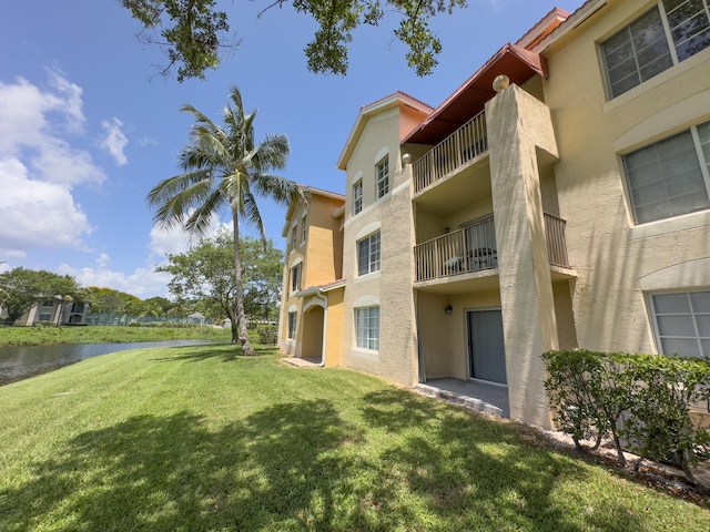 view of building exterior featuring a water view