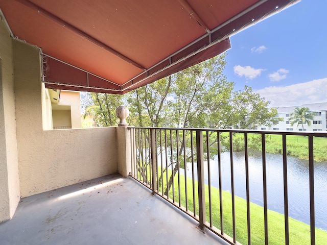 balcony featuring a water view