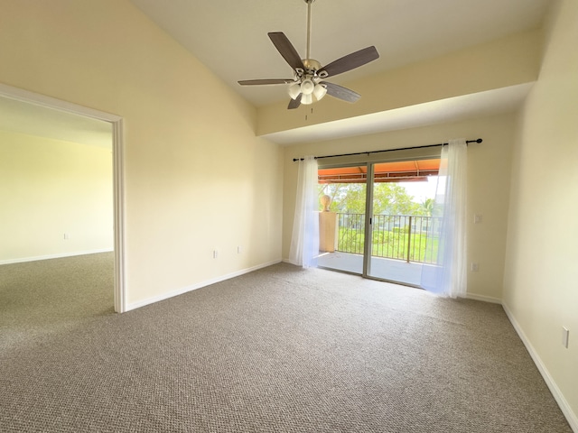 unfurnished room featuring lofted ceiling, carpet, and ceiling fan