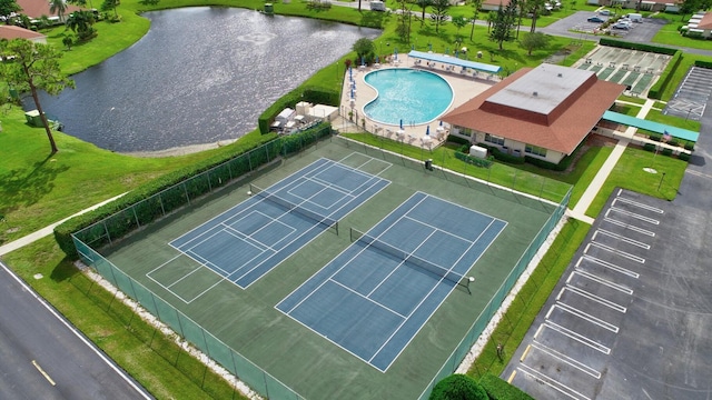 birds eye view of property with a water view