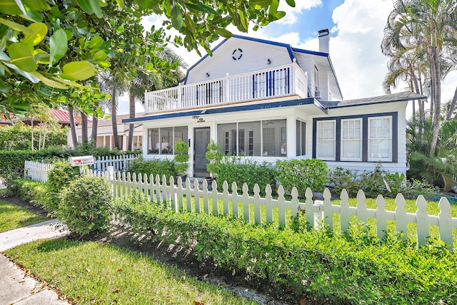 view of front of home with a balcony