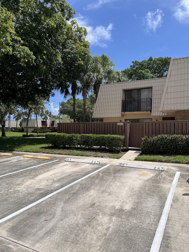 uncovered parking lot with fence