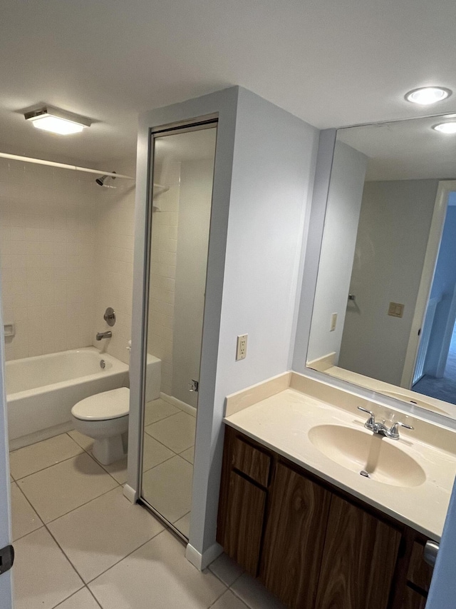 bathroom with vanity, toilet, and tile patterned floors