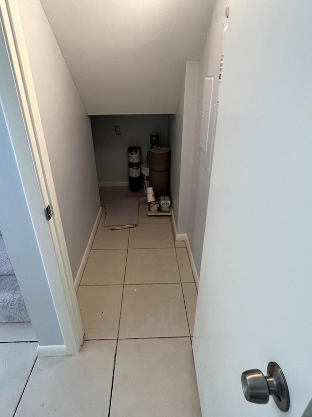 corridor with light tile patterned flooring