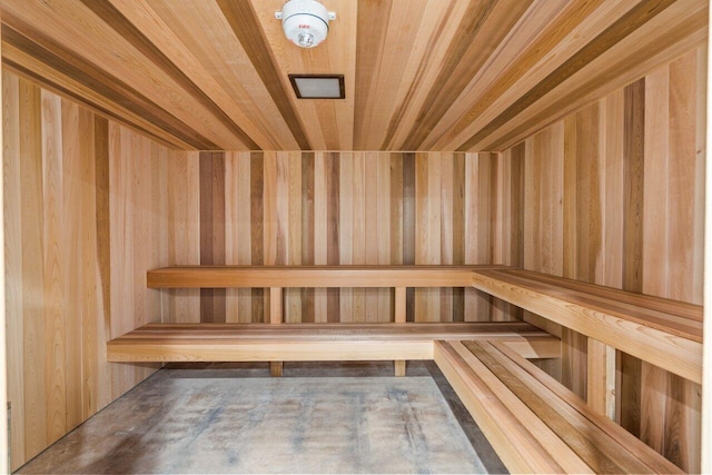 view of sauna / steam room with wooden walls