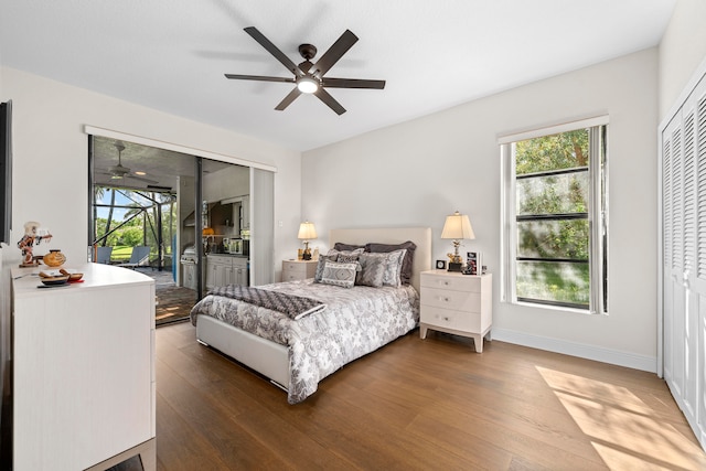 bedroom with ceiling fan, hardwood / wood-style flooring, and multiple windows