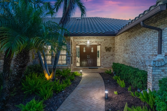 exterior entry at dusk with french doors