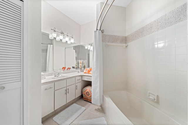 bathroom with vanity, shower / bathtub combination with curtain, and tile patterned floors