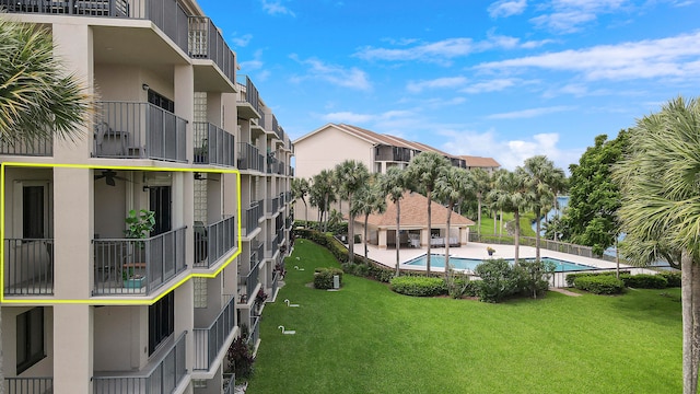 balcony with a water view and ceiling fan