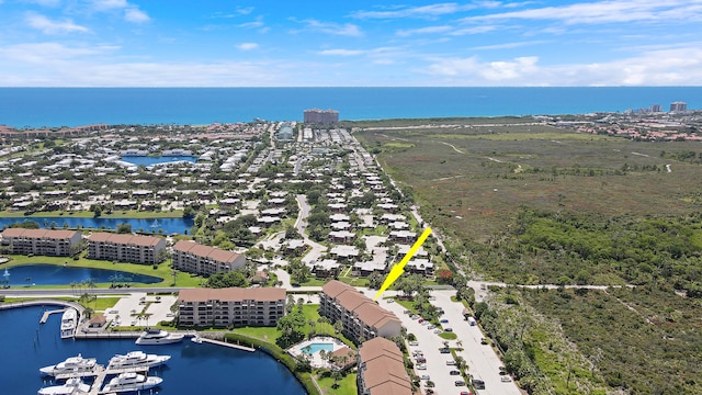 birds eye view of property featuring a water view