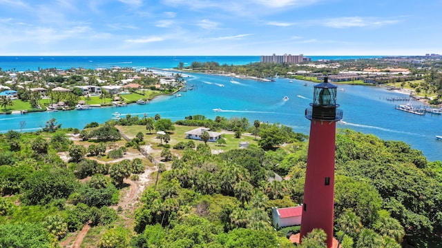 drone / aerial view with a water view and a view of the beach