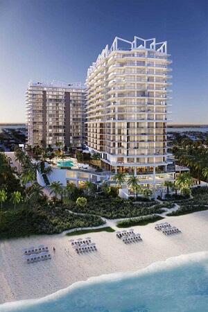 view of building exterior with a view of the beach and a water view