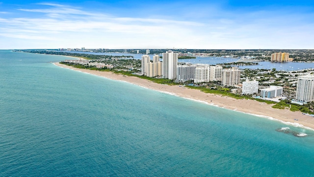 aerial view with a water view and a view of the beach