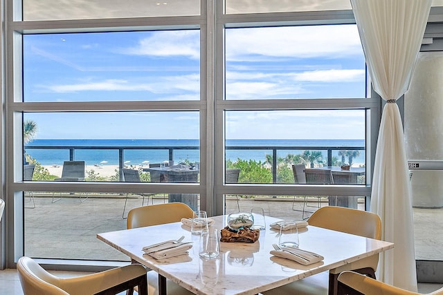 dining room featuring a water view