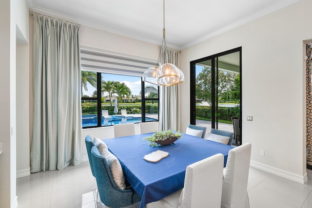 dining area featuring an inviting chandelier, light tile patterned floors, and crown molding