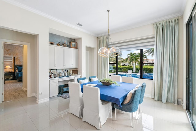 tiled dining space with ornamental molding and built in shelves