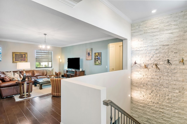 interior space with ornamental molding, dark hardwood / wood-style flooring, and a chandelier