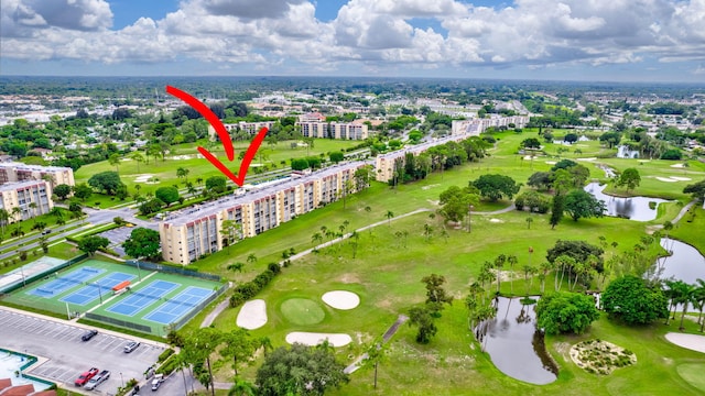 birds eye view of property with a water view