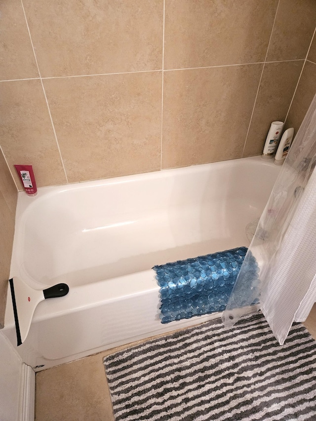 bathroom featuring a tub to relax in