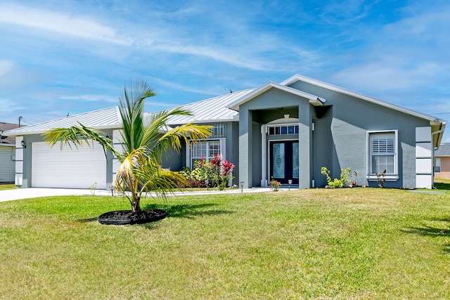 view of front of property featuring a front lawn and a garage