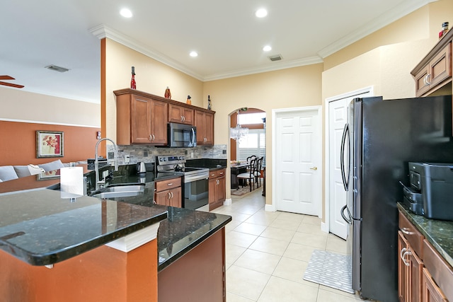 kitchen with ornamental molding, sink, kitchen peninsula, tasteful backsplash, and stainless steel appliances