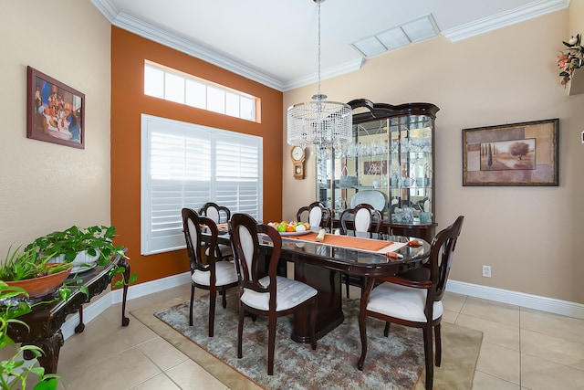 tiled dining room with a notable chandelier and ornamental molding