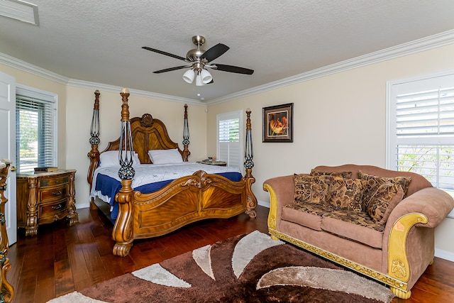 bedroom featuring ceiling fan, a textured ceiling, crown molding, and dark hardwood / wood-style flooring