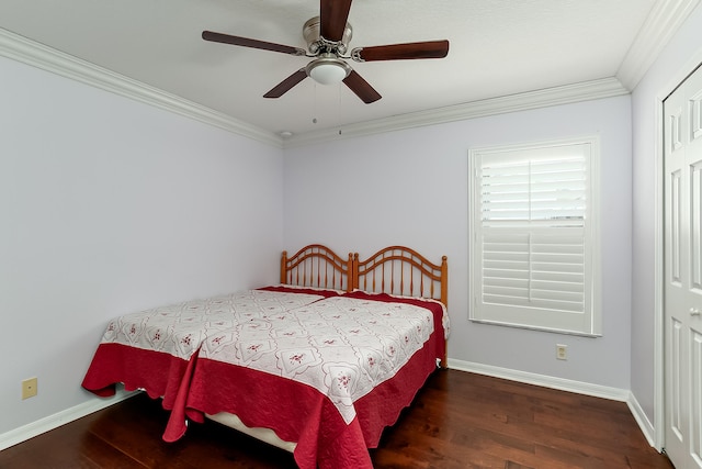 bedroom with ceiling fan, a closet, crown molding, and dark hardwood / wood-style flooring