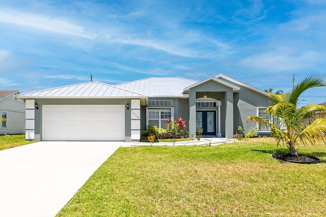 ranch-style home featuring a garage and a front yard