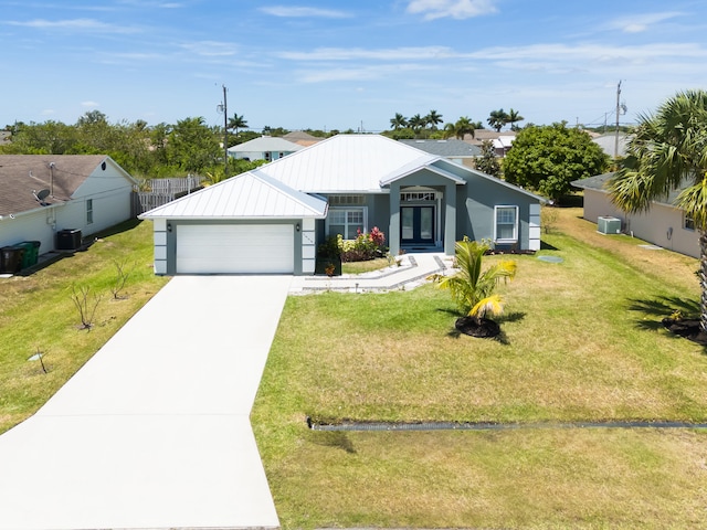 view of front facade featuring central AC unit, a front yard, and a garage