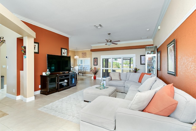 living room featuring ceiling fan, crown molding, and light tile patterned floors