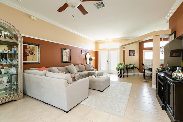 living room featuring crown molding, light tile patterned flooring, ceiling fan, and french doors