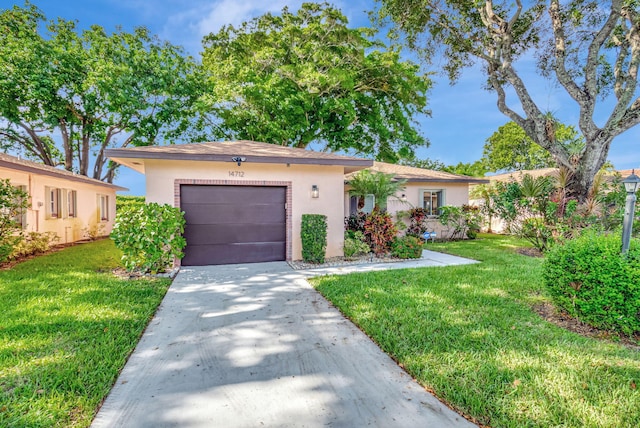 ranch-style house with a garage and a front lawn