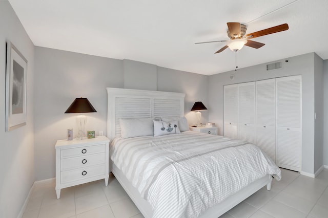 bedroom with a closet, ceiling fan, and light tile patterned floors