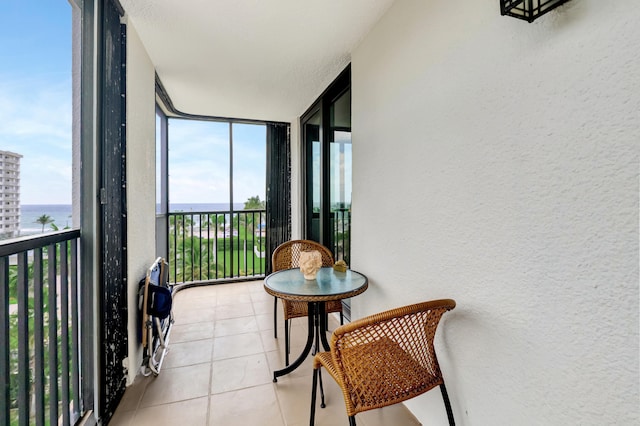 balcony featuring a water view