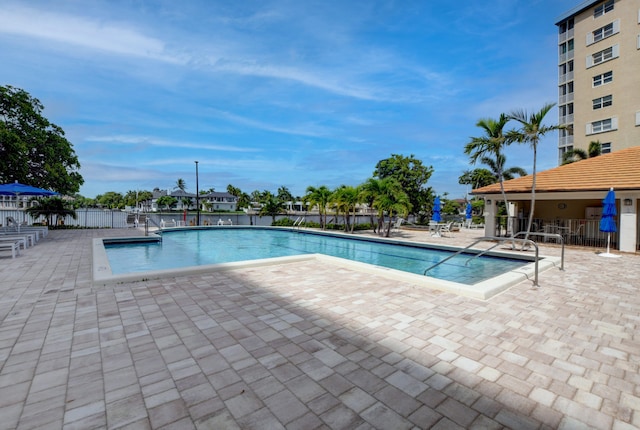 view of swimming pool with a patio area