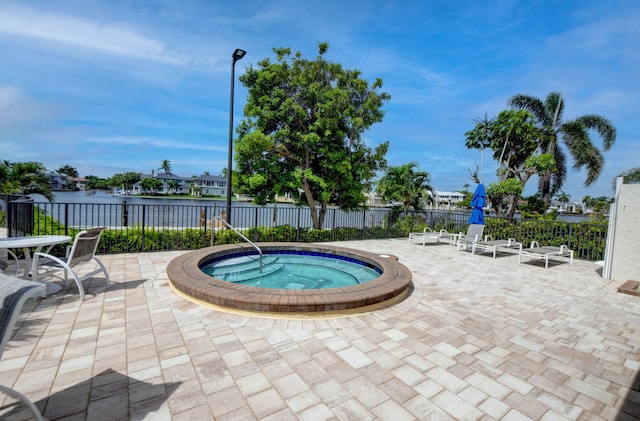 view of pool featuring a community hot tub and a patio