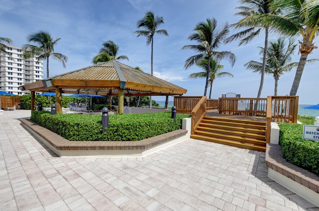 view of home's community with a gazebo and a water view