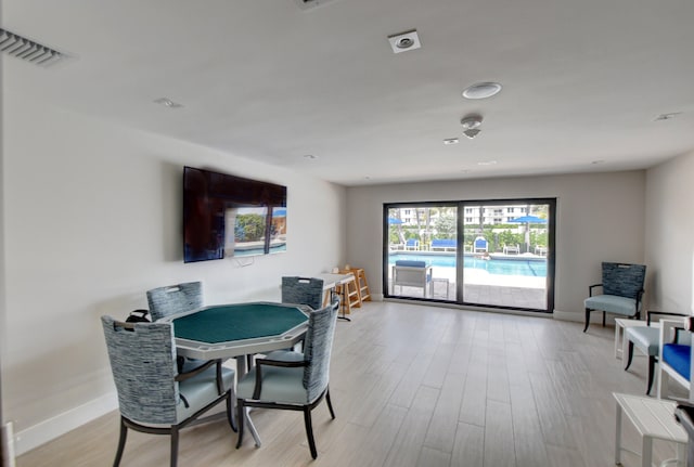 dining area with light hardwood / wood-style floors