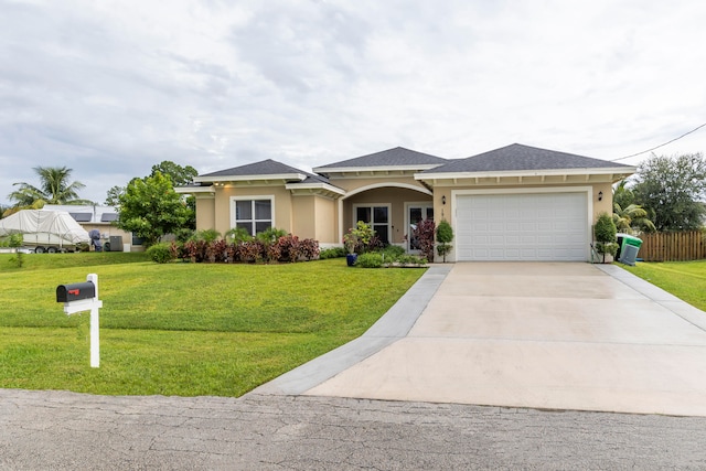 view of front facade featuring a garage and a front lawn