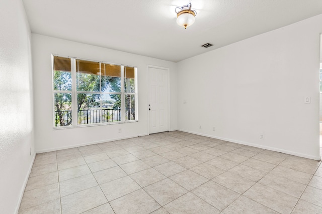 view of tiled spare room