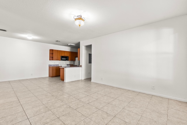 unfurnished living room with light tile patterned floors