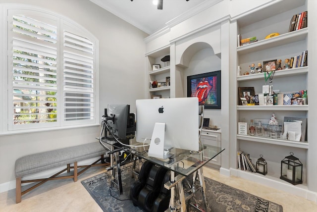 home office featuring built in features, crown molding, and baseboards